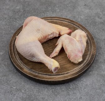 Close up photo raw organic chicken meat on wooden board